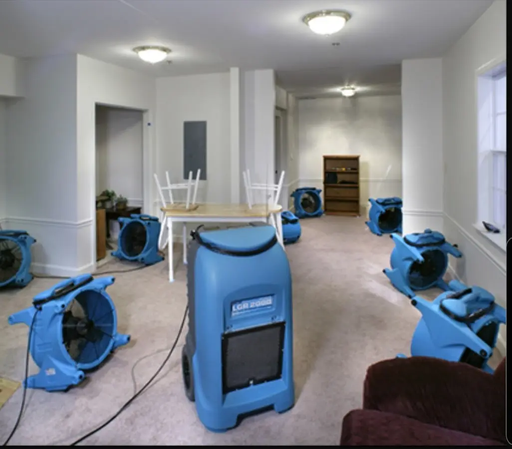 Air movers and dehumidifier setup for Water Damage Restoration in Amelia